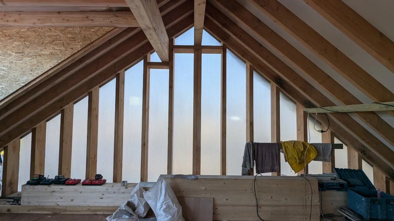 Timber structure and polycarbonate façade during assembly on a KiteHouse building site